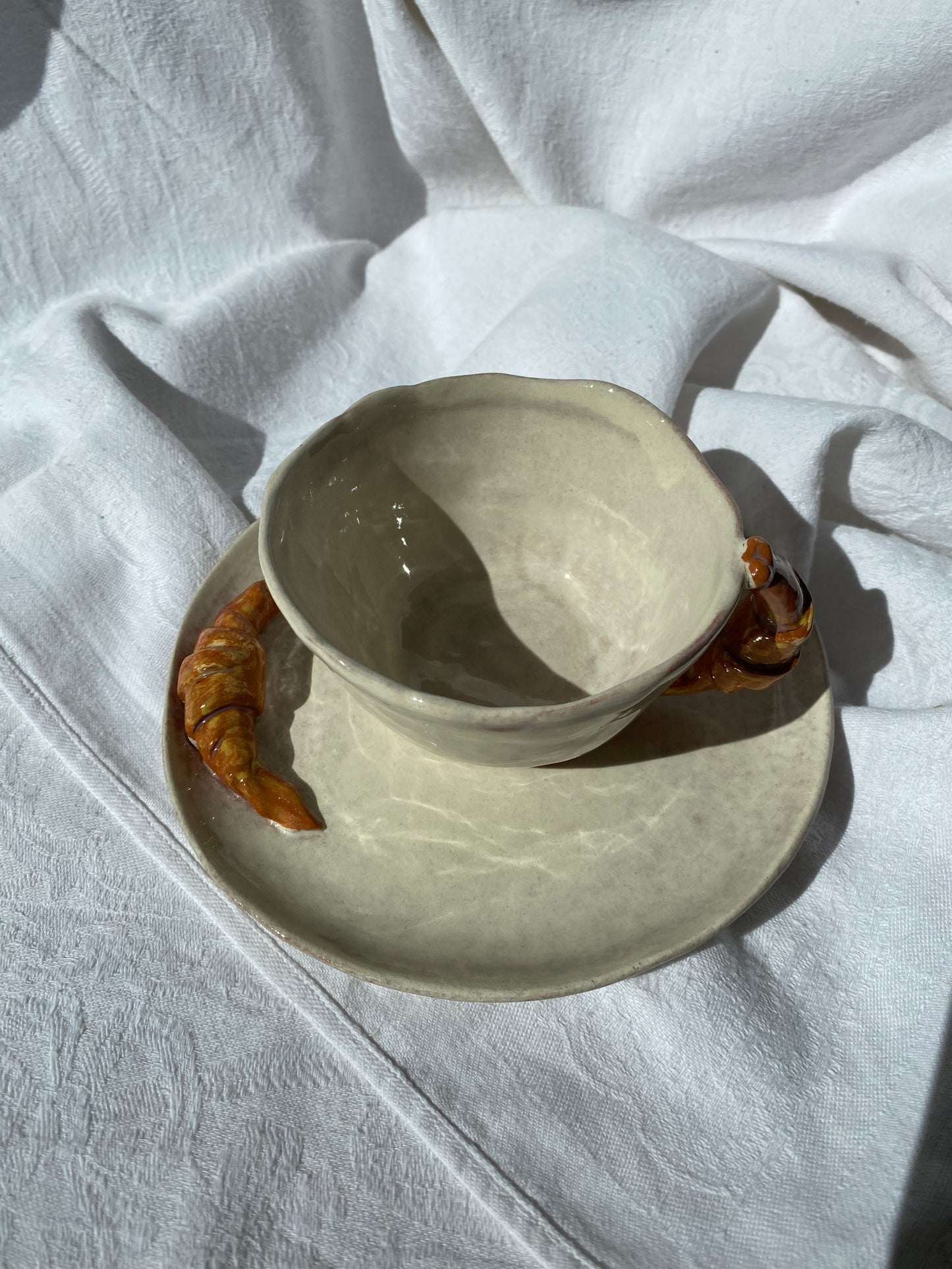 Tasse avec soucoupe à croissant