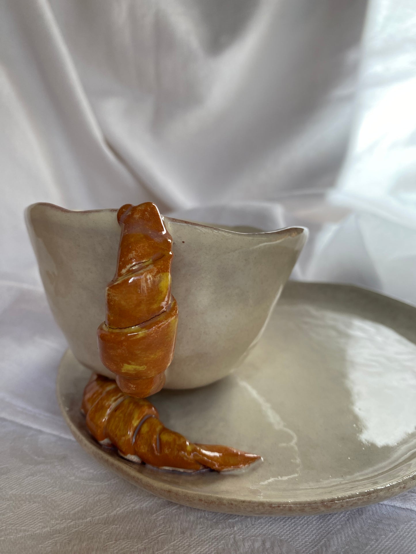 Tasse avec soucoupe à croissant